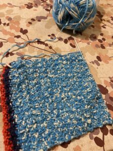 Neulos, jossa on sinistä ja valkoista.