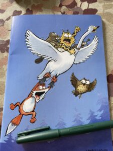 Vihko, jonka kannessa on erilaisia eläinhahmoja.